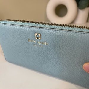 Baby blue Kate spade zipper wallet.